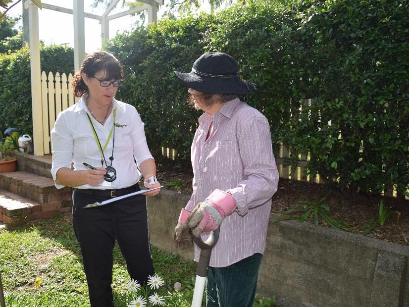 Janine Holt with client in garden